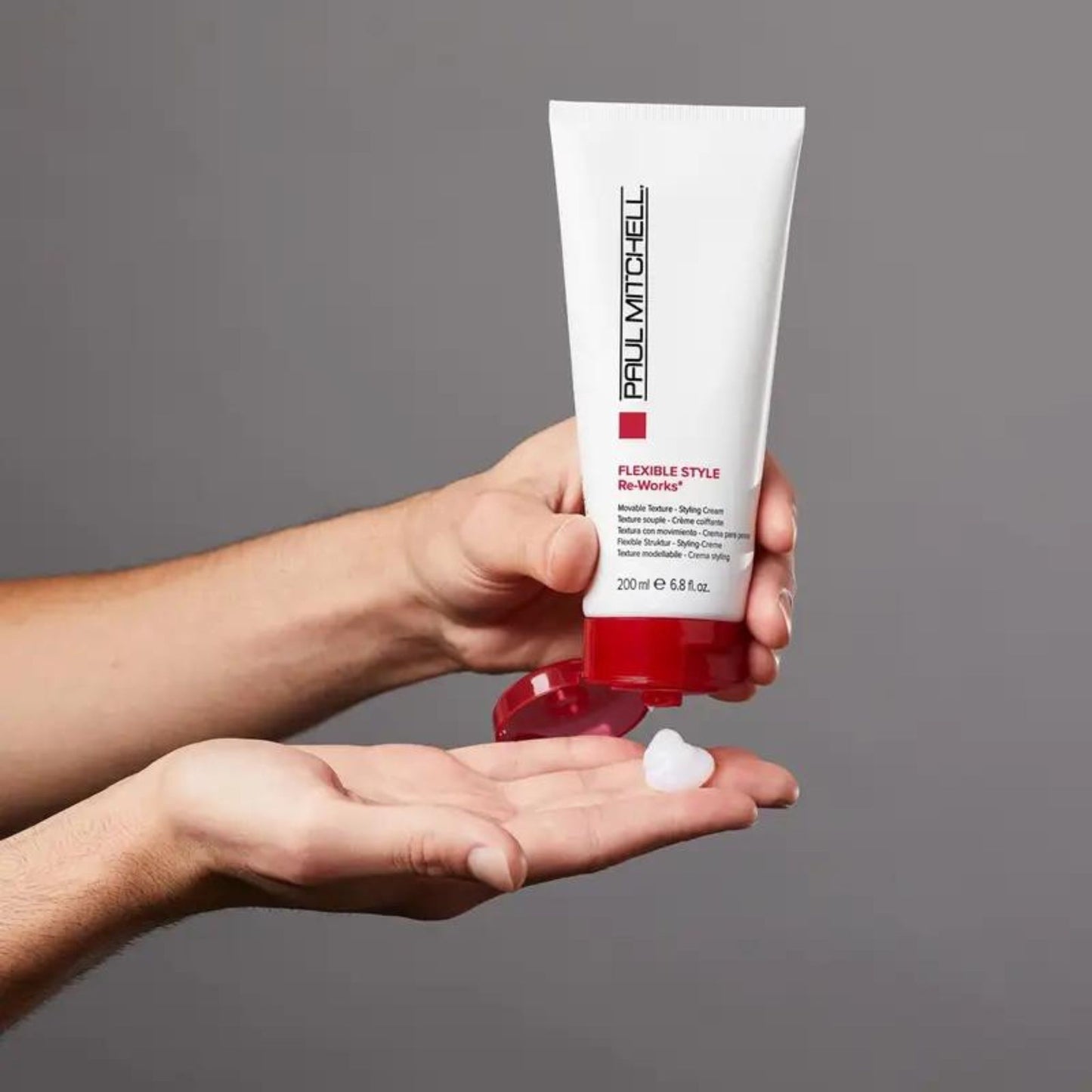 Re-Works Styling Cream - Salon Blissful - Paul Mitchel - product from bottle squeezed on to model's hand.