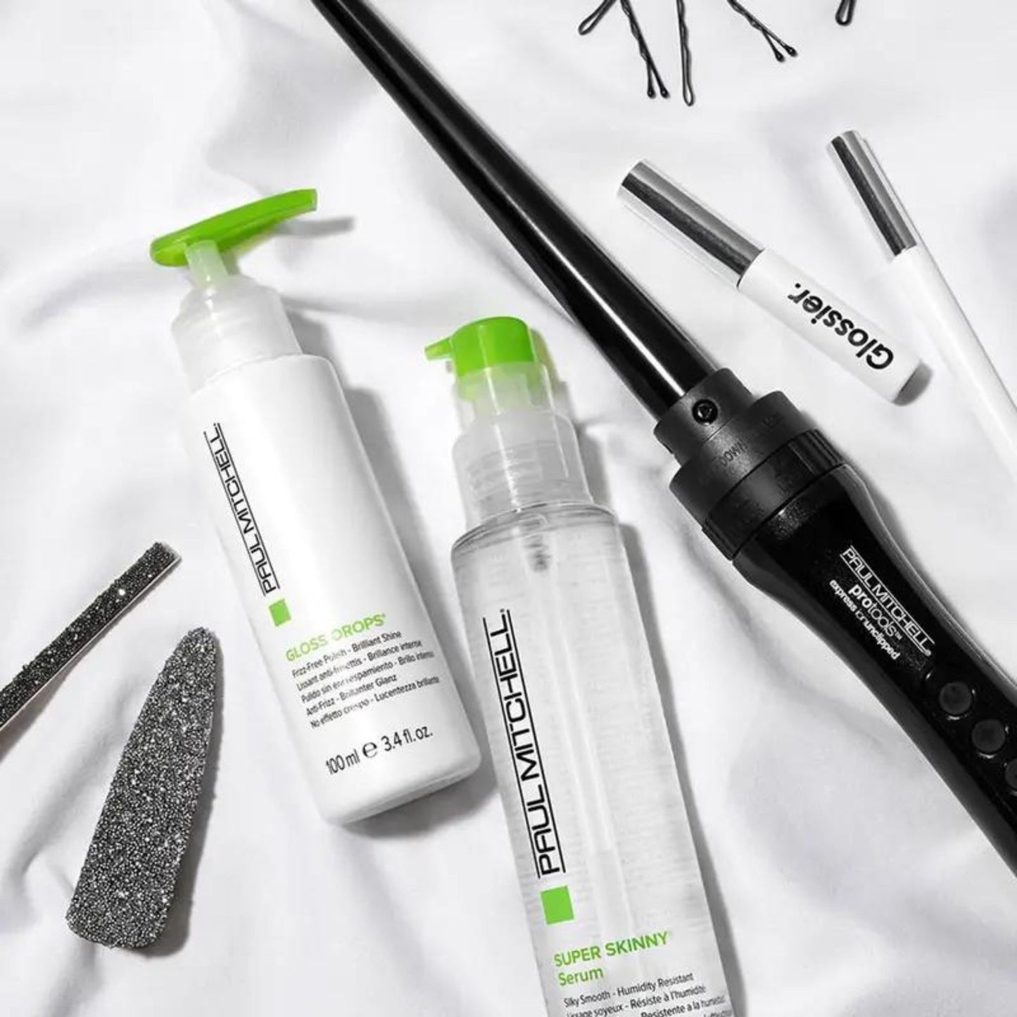 Super Skinny Serum - SB flat lay with styling tools on white backdrop.