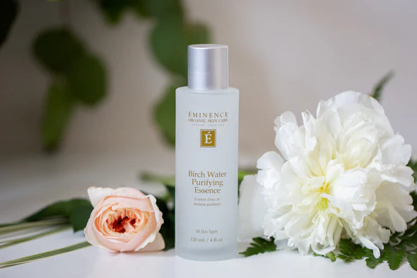 Eminence Birch Water Purifying Essence flower flatlay