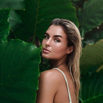 Bronzed Beauty Self-Tanning Mousse model in tropics