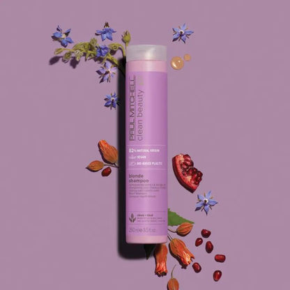 Clean Beauty Blonde Shampoo - Salon Blissful - Paul Mitchell  -  product flat lay with flowers and fruit on purple background