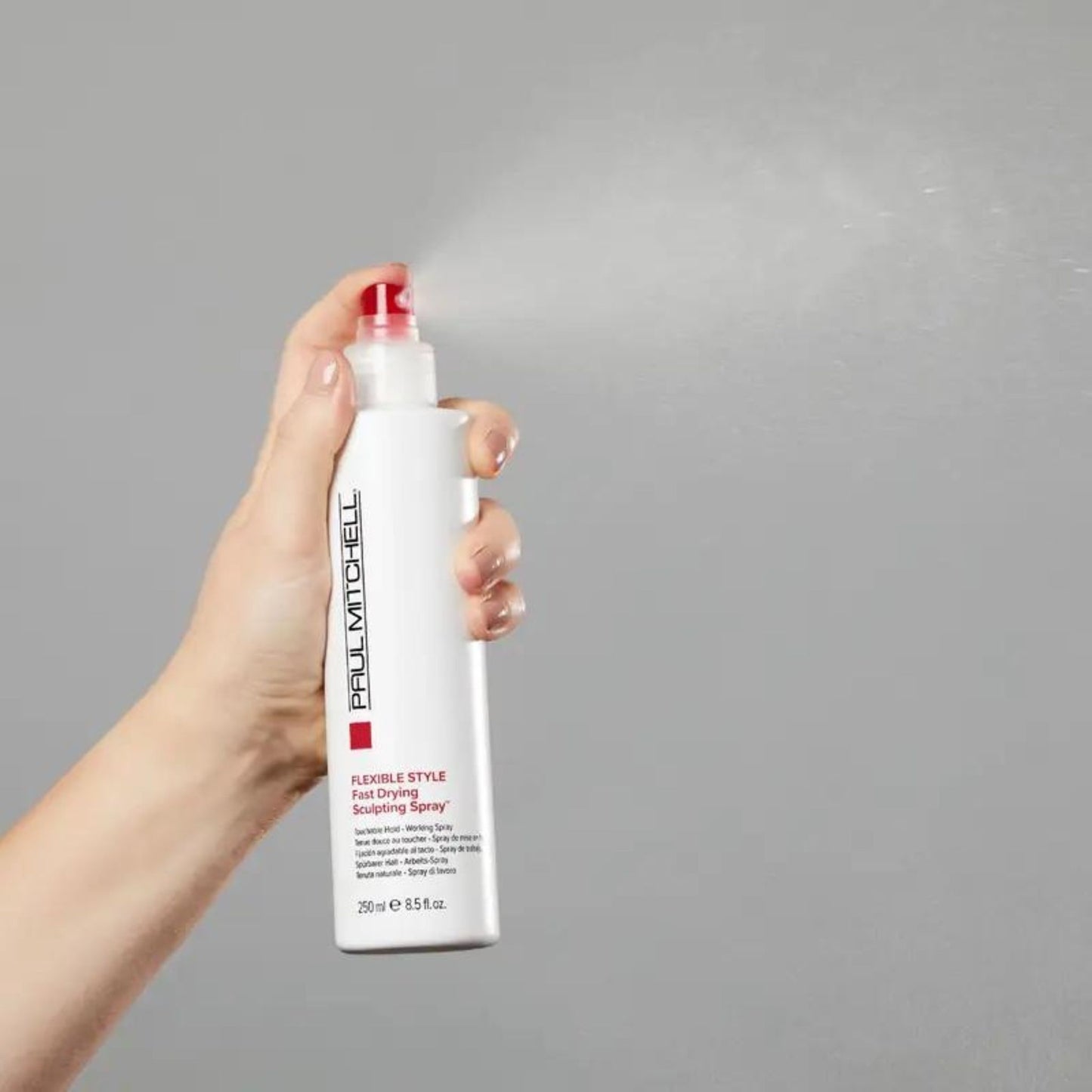 Fast Drying Sculpting Spray - Salon Blissful - Paul Mitchell - model spraying product