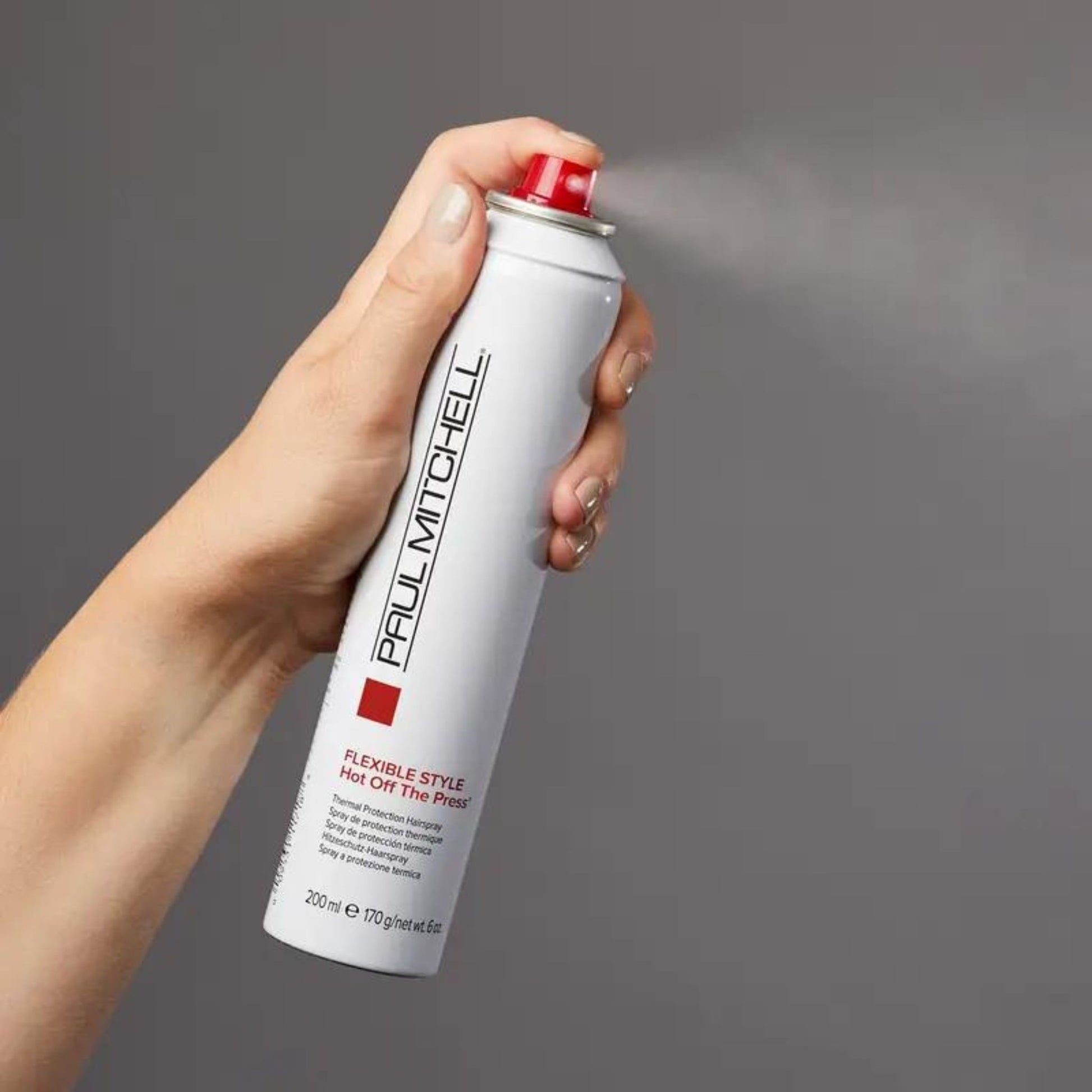 Hot Off The Press Thermal Protection Hairspray - Salon Blissful - Paul Mitchell - model spraying bottle 