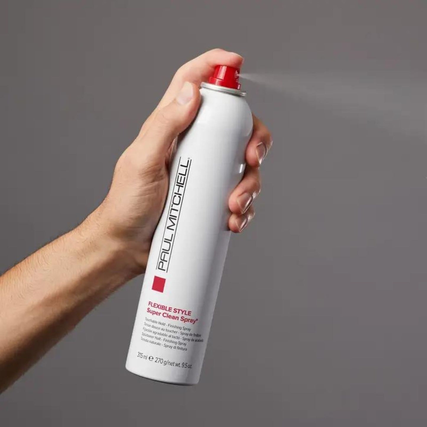 Super Clean Spray - Salon Blissful - Paul Mitchell - model spraying bottle